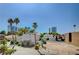Charming single-Gathering home surrounded by lush palm trees and clear blue skies, with city views at 2851 Queens Courtyard Dr, Las Vegas, NV 89109