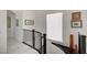 Hallway featuring marble floors, recessed lighting and modern decor leading to additional rooms at 2851 Queens Courtyard Dr, Las Vegas, NV 89109