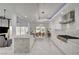 Gourmet kitchen featuring white cabinets, stainless steel appliances and a granite-topped kitchen island at 2851 Queens Courtyard Dr, Las Vegas, NV 89109