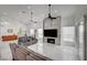 Open-concept living area with modern fireplace, sleek flooring, and generous natural light at 2851 Queens Courtyard Dr, Las Vegas, NV 89109