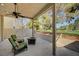 Covered patio features outdoor seating and spiral staircase, offering serene golf course views at 2851 Queens Courtyard Dr, Las Vegas, NV 89109
