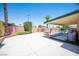 Large concrete backyard with a covered patio, fenced pool, and dining area perfect for entertaining at 3484 Anthony Dr, Las Vegas, NV 89121
