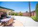 Expansive backyard featuring a covered patio area and mature landscaping for privacy at 3484 Anthony Dr, Las Vegas, NV 89121