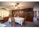 Welcoming dining area, open to both the kitchen and living spaces, with warm wood accents and cozy lighting at 3484 Anthony Dr, Las Vegas, NV 89121