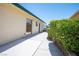 Side view of the property highlighting the walkway, siding, and manicured landscaping at 3484 Anthony Dr, Las Vegas, NV 89121