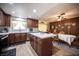The kitchen boasts stainless steel appliances and lovely wood cabinets, seamlessly flowing into the dining area at 3484 Anthony Dr, Las Vegas, NV 89121