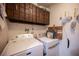 Laundry room features a Maytag washer and dryer with upper storage cabinets at 3484 Anthony Dr, Las Vegas, NV 89121