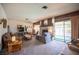 Inviting living room with a stone fireplace and sliding glass doors to the pool area at 3484 Anthony Dr, Las Vegas, NV 89121