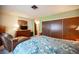 A carpeted main bedroom with natural light and a flat-screen television at 3484 Anthony Dr, Las Vegas, NV 89121