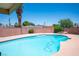 Inviting backyard pool with a diving board, surrounded by a brick fence and greenery, perfect for outdoor enjoyment at 3484 Anthony Dr, Las Vegas, NV 89121