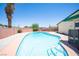 This backyard features a large, sparkling pool, perfect for cooling off on hot days at 3484 Anthony Dr, Las Vegas, NV 89121