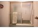 This bathroom includes a shower with a built in bench and sliding glass door at 3484 Anthony Dr, Las Vegas, NV 89121