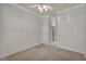 Bedroom with a ceiling fan, carpet, and access to a closet at 37 Stonemark Dr, Henderson, NV 89052