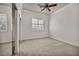 Bedroom with a ceiling fan, carpet, and closet with mirrored doors at 37 Stonemark Dr, Henderson, NV 89052