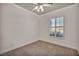 Bedroom with a ceiling fan and a window with plantation shutters at 37 Stonemark Dr, Henderson, NV 89052