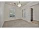 Carpeted bedroom with plantation shutters and neutral walls creates a serene and inviting atmosphere at 37 Stonemark Dr, Henderson, NV 89052
