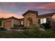 Exterior of home at dusk with desert landscaping and tile roof at 37 Stonemark Dr, Henderson, NV 89052
