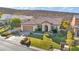 Aerial view of a single-Gathering home with manicured front yard, desert landscaping, and ample driveway space at 37 Stonemark Dr, Henderson, NV 89052