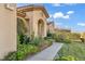 Front entrance of the home with walkway and manicured landscaping at 37 Stonemark Dr, Henderson, NV 89052