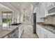 Modern kitchen includes granite countertops, stainless steel appliances, and ample cabinet space at 37 Stonemark Dr, Henderson, NV 89052