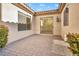 Private patio area with brick pavers and desert landscaping at 37 Stonemark Dr, Henderson, NV 89052
