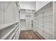 Spacious walk-in closet features custom shelving, drawers, and ample storage space for organization at 37 Stonemark Dr, Henderson, NV 89052
