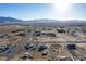 Overhead aerial view featuring houses in a desert setting, with striking mountains visible in the horizon at 3821 Tumbleweed Ave, Pahrump, NV 89048