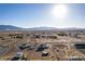 Wide aerial perspective featuring homes in a desert landscape against the backdrop of majestic mountains at 3821 Tumbleweed Ave, Pahrump, NV 89048