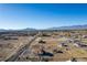 Scenic aerial shot showcases a desert community with single-Gathering homes and beautiful mountain backdrop at 3821 Tumbleweed Ave, Pahrump, NV 89048