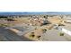 Aerial view of home with desert landscaping including circular driveway and view of surrounding community at 3821 Tumbleweed Ave, Pahrump, NV 89048
