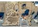 Expansive aerial view of property with horse facilities, paddocks, and desert landscape at 3821 Tumbleweed Ave, Pahrump, NV 89048