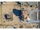 Aerial view of equestrian property with home, stables, and horse paddocks at 3821 Tumbleweed Ave, Pahrump, NV 89048