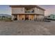 Backyard of the home featuring porch, outdoor furniture, and desert landscaping at 3821 Tumbleweed Ave, Pahrump, NV 89048