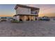 Backyard of the home featuring an RV, porch, outdoor furniture, and desert landscaping at 3821 Tumbleweed Ave, Pahrump, NV 89048