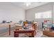 Bright bedroom, featuring bright window light, bare walls, and hardwood floors at 3821 Tumbleweed Ave, Pahrump, NV 89048