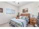 Cozy bedroom featuring a wooden bed frame and scenic views at 3821 Tumbleweed Ave, Pahrump, NV 89048