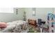 Bedroom with exercise equipment, stuffed animals, and window at 3821 Tumbleweed Ave, Pahrump, NV 89048