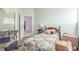 Cozy bedroom featuring a comfortable bed, wardrobe, and natural light at 3821 Tumbleweed Ave, Pahrump, NV 89048