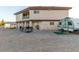 Two-story home with a balcony, covered patio, and lots of land to make this property your own at 3821 Tumbleweed Ave, Pahrump, NV 89048