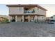 Two-story home with a balcony, covered patio, and lots of land to make this property your own at 3821 Tumbleweed Ave, Pahrump, NV 89048
