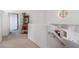 Upstairs hallway featuring bright lighting, staircase, and an open floorplan at 3821 Tumbleweed Ave, Pahrump, NV 89048