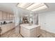 Bright kitchen featuring wood floors, an island, and stainless steel appliances at 3821 Tumbleweed Ave, Pahrump, NV 89048