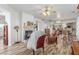 Expansive living room with a fireplace, wood flooring, and easy access to kitchen at 3821 Tumbleweed Ave, Pahrump, NV 89048