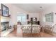 Cozy living room boasts fireplace, comfortable seating, and views to adjacent sitting area at 3821 Tumbleweed Ave, Pahrump, NV 89048