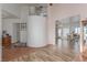 Spacious living area with wood floors, adjacent rooms, and ample natural light at 3821 Tumbleweed Ave, Pahrump, NV 89048