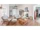 Open living room with fireplace, wood floors, and comfortable seating area at 3821 Tumbleweed Ave, Pahrump, NV 89048