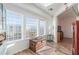 Sun-filled living room with textured windows, wood floors, and neutral decor at 3821 Tumbleweed Ave, Pahrump, NV 89048