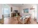 Comfortable living room with wicker furniture, wood floors, and natural light at 3821 Tumbleweed Ave, Pahrump, NV 89048