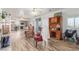 Open-concept living area flows into kitchen with modern floors and natural light at 3821 Tumbleweed Ave, Pahrump, NV 89048
