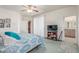 Bedroom with a television, and doorway to a bathroom at 3821 Tumbleweed Ave, Pahrump, NV 89048